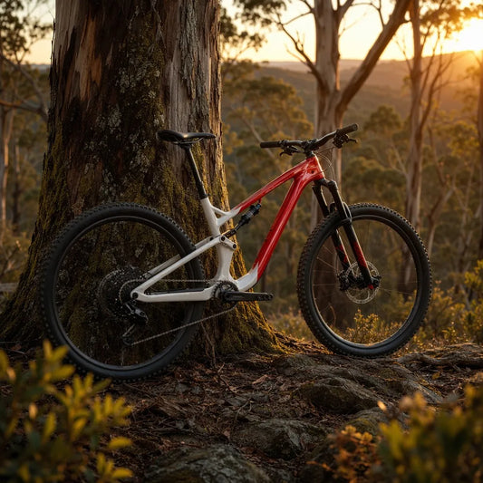 A cinematic shot of a red and white 2026 Rocky Mountain Instinct C70 in an Australian forest.