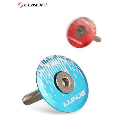 Close-up of Blue and Red LUNJE headset caps with bolts